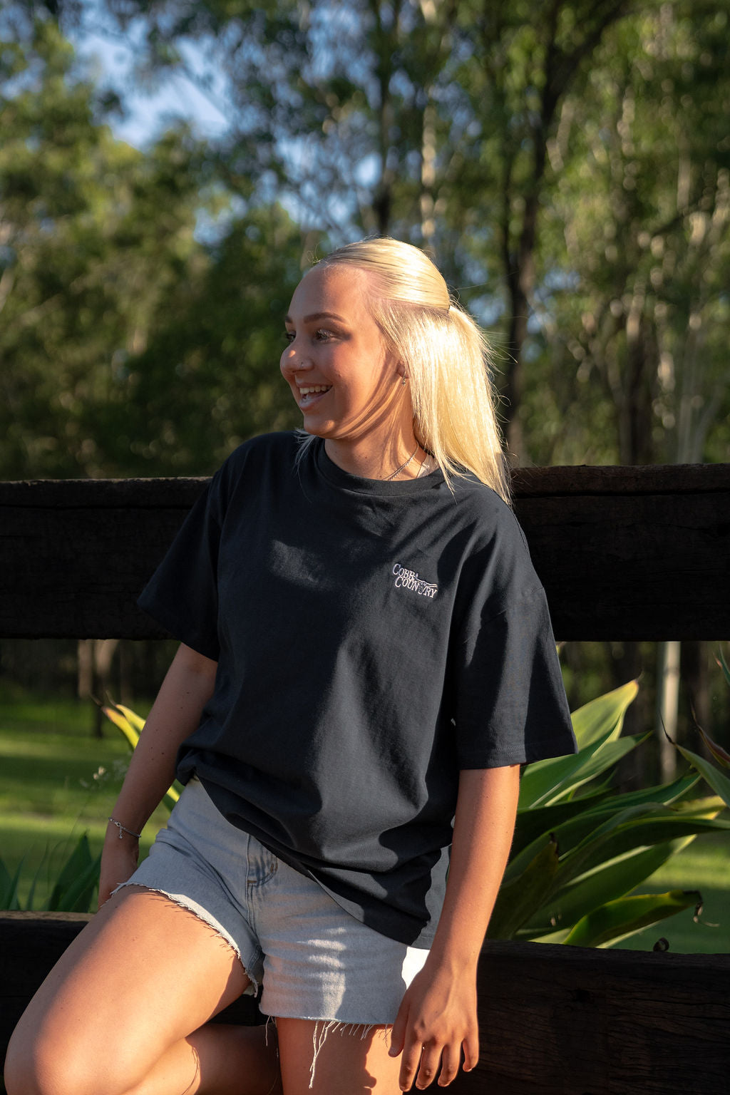 female wearing cobba country navy big tee